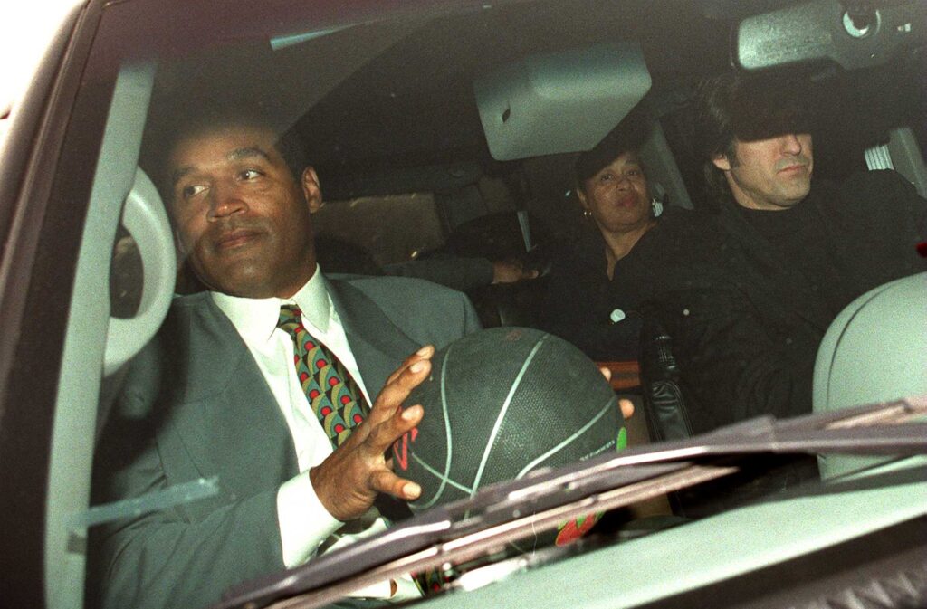 01-28-97 Los Angeles, Ca O.J. Simpson leaving courtduring his civil case holding a basket ball in his